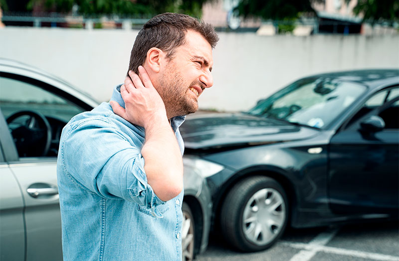 a man in need of auto accident chiropractor in San Diego, CA